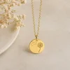 A Gold Dandelion Charm Pendant on a Gold rolo link chain