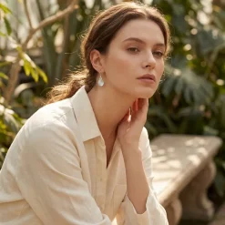 Model wears Hammered Tear Drop Silver earrings