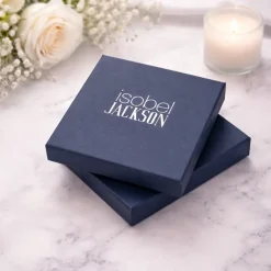 Isobel Jackson Blue presentation Jewellery boxes on a white marble background with white roses